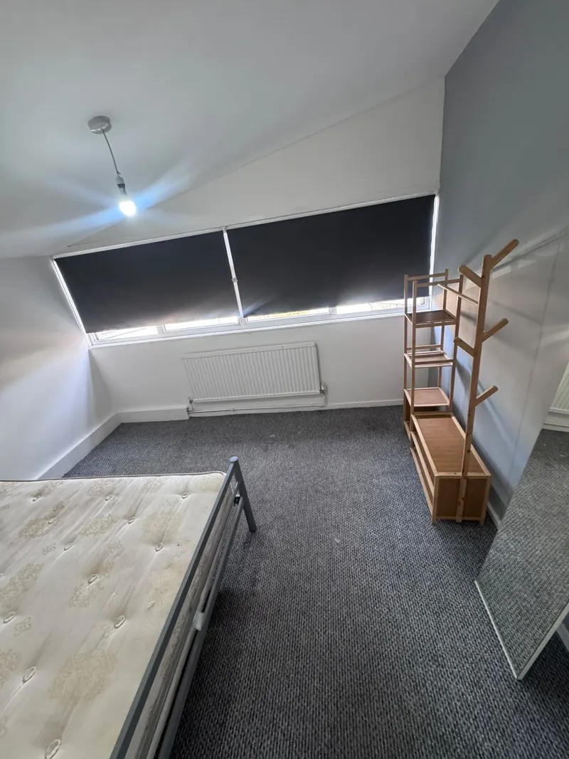 Bedroom shelving beside the window