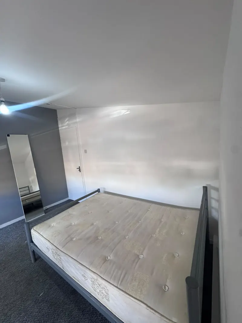 Bed and painted bedroom walls