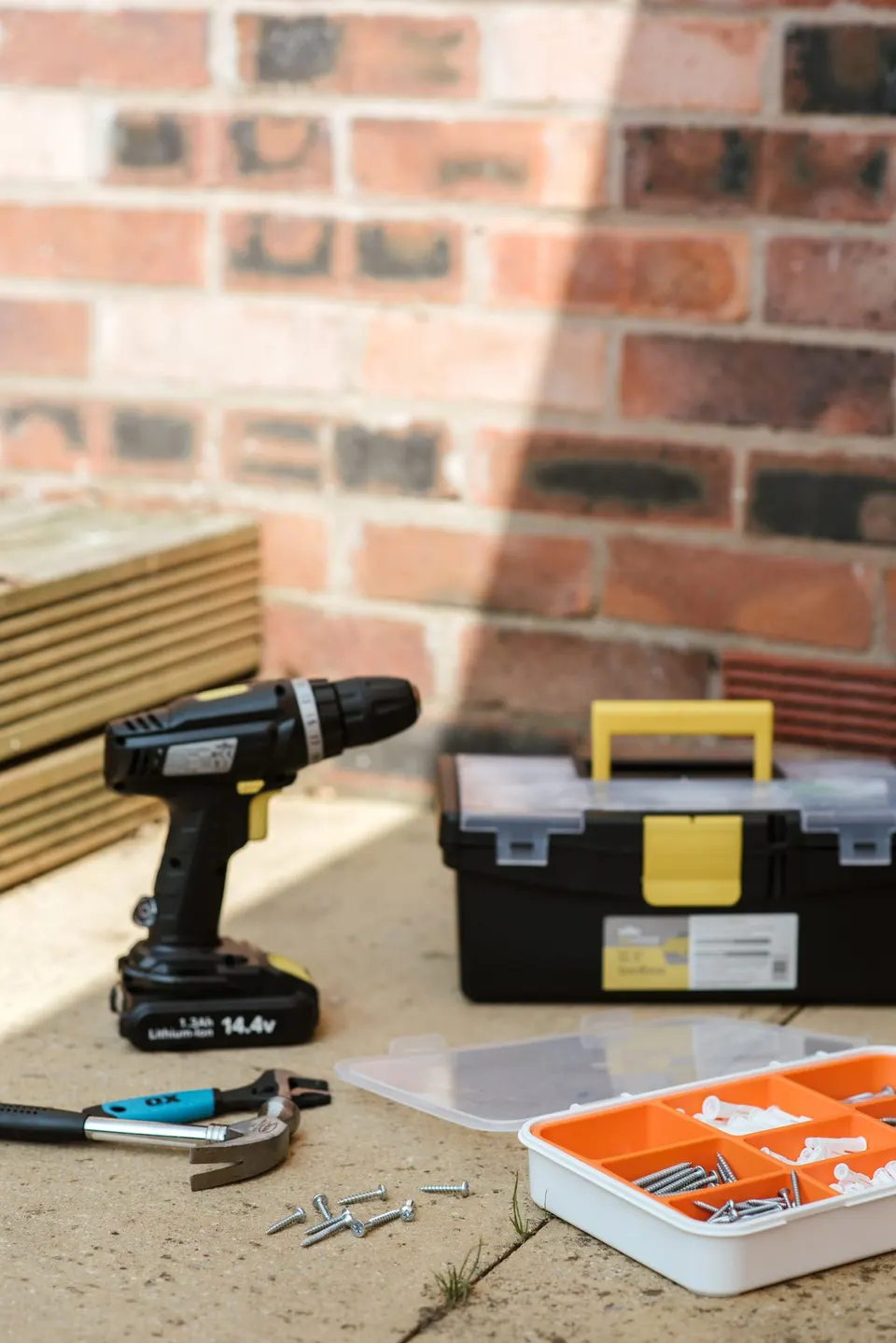 Toolbox, drill and hammer ready for property repairs